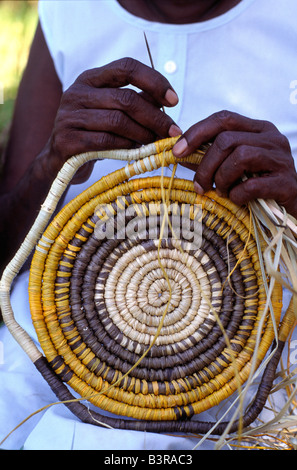 Aboriginal woman weaving a traditional pandanus mat in Arnhem Land ...