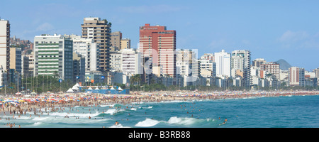 A 2 picture stitch panoramic view of Ipanema beach in Rio De Janeiro during a busy holiday period. Stock Photo