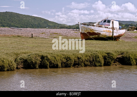 Old Fishing Boat Stranded on Coastal Marshland At Porlock Weir in Somerset West of England Stock Photo