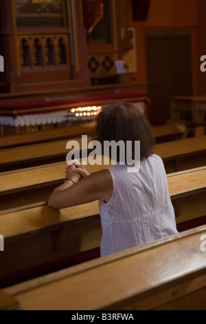 Woman in prayer Catholic church Zielona Gora Poland Stock Photo