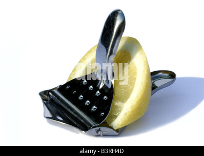 Lemon Slice in Squeezer Stock Photo