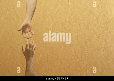 Two hands reaching towards each other Stock Photo