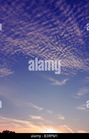 Cirrocumulus and Altocumulus clouds at sunset Stock Photo