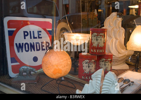 Wide range of various antiques and second hand items for sale in shops along the Rue Blaes in Brussels, Belgium