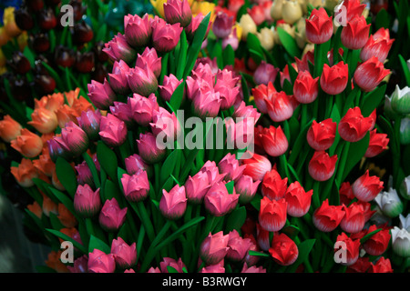 Carved multicolour wooden tulips at flower market in Amsterdam, the Netherlands. Perfect Dutch souvenir. Stock Photo