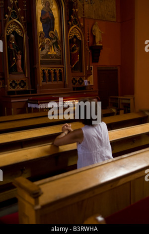 Woman in prayer Catholic church Zielona Gora Poland Stock Photo