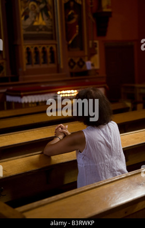 Woman in prayer Catholic church Zielona Gora Poland Stock Photo