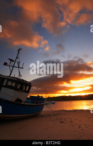 Boats on the tidal Aln Estuary at Alnmouth. The hill in 