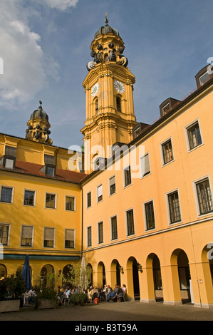 People siting in a restaurant in inner courtyard of the Theatine Church of St. Cajetan in the city of Munich capital of Bavaria Germany Stock Photo