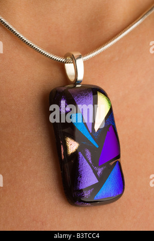 handmade coloured glass pendant jewellery using dichroic coatings Stock Photo