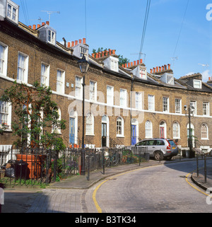 A row of traditional terraced brick houses housing at Keystone Crescent near the Caledonian Road in the area of Kings Cross London N1 UK  KATHY DEWITT Stock Photo