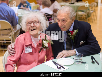 A 99-Year-old Man and a 100-year-old woman chat during a party for centenarians in Woodbridge Connecticut USA Stock Photo