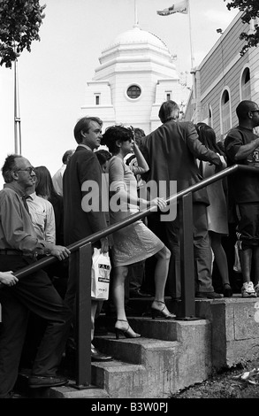 Football fans waiting on the steps of Wembley Stadium before the 1998 Arsenal v Newcastle FA Cup Final. Stock Photo