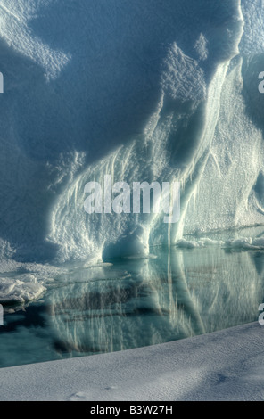 An Iceberg on Cobourg Island in the Canadian Arctic melting in the sunlight. Stock Photo