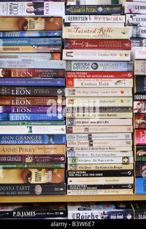 Pile stack of secondhand paperback novels and books for sale Stock Photo