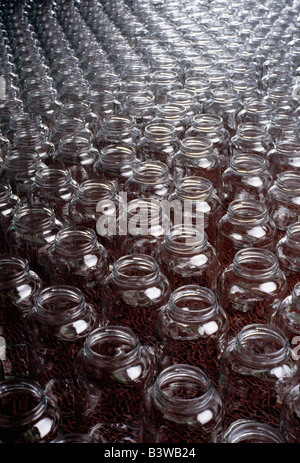 Glass bottles on the assembly line of a glass product manufacturing plant Stock Photo