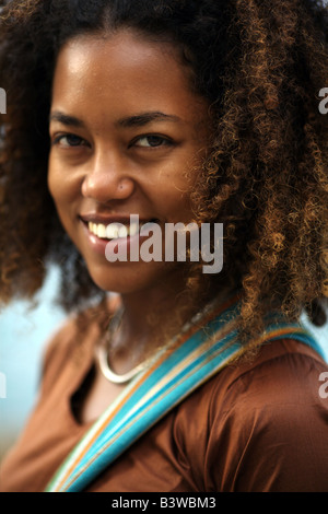 Headshot portrait of a young black lady looking straight at the camera Stock Photo