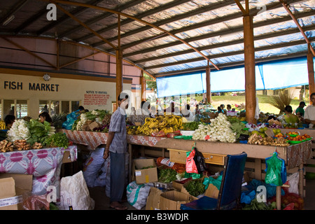 Oceania, Fiji, Viti Levu, Nadi. Merchant with produce for sale in an open-air market. Stock Photo