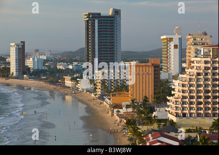 Mexico, Sinaloa State, Mazatlan. Zona Dorada / Golden Hotel Zone-Playa Las Gaviotas Beach and Hotels / Sunset Stock Photo