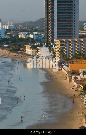 Mexico, Sinaloa State, Mazatlan. Zona Dorada / Golden Hotel Zone-Playa Las Gaviotas Beach and Hotels / Sunset Stock Photo