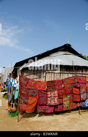 Central America, Panama, San Blas Islands. Colorful hand stitched molas, made by the Kuna Indians, hanging on typical homes. Stock Photo