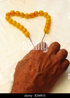 Greece Crete Male hand holding worry beads Stock Photo