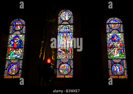 A stained glass window in the church of St Lawrence in Warkworth, Northumberland. Stock Photo