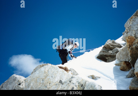 Mountain climber descending from a mountain, Elbrus region, Greater Caucasus range, Kabardino-Balkaria, Russia Stock Photo