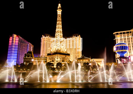 The fountains of the Bellagio Hotel and Casino dance in front of the Paris Hotel and Casino in Las Vegas Nevada Stock Photo