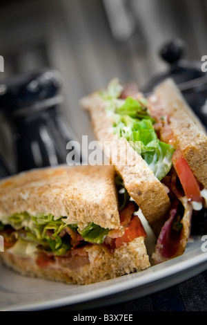 Toasted bacon lettuce and tomato sandwich on a white plate Stock Photo