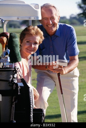 Senior couple portrait on golf course Stock Photo