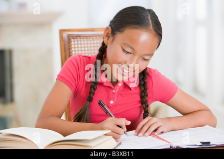 Girl Doing Her Homework Stock Photo