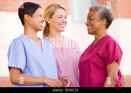 Nurses Standing Outside A Hospital Stock Photo