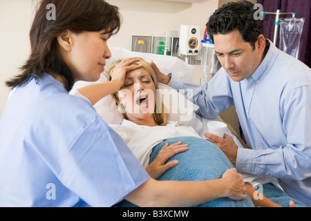 Woman Giving Birth Stock Photo