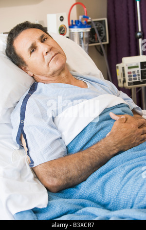 Man Lying In Hospital Bed Stock Photo