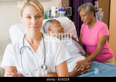 Doctor Standing In Hospital Room With Her Arms Folded Stock Photo