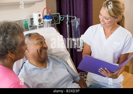 Doctor Making Notes About Patient Stock Photo