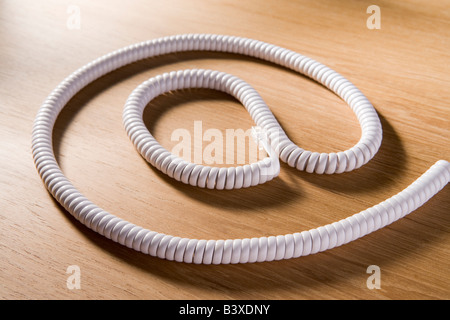 Telephone Cord Making 'At' Symbol Stock Photo