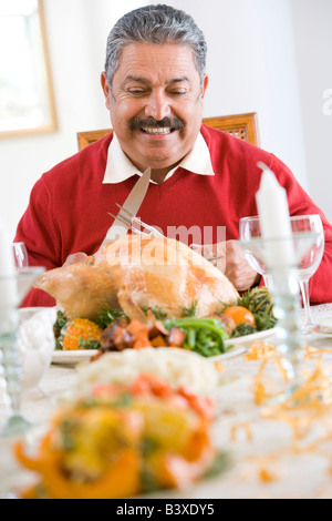 Senior Man Excitedly Getting Ready To Carve The Turkey Stock Photo