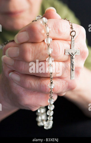 Close-Up Of Elderly Person Holding Rosary Beads Stock Photo