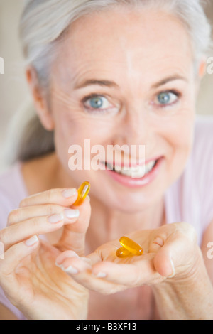 Woman Taking Pills Stock Photo