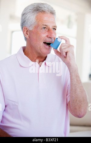 Man Using An Inhaler Stock Photo