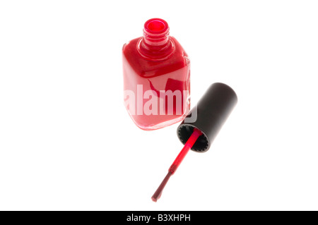 Red nail polish and brush on white Stock Photo