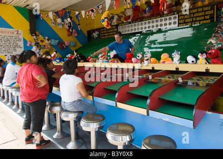 People waiting to play a game at the Coney Island amusement park in Brooklyn New York Stock Photo