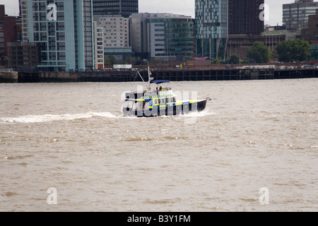 Police boat on the Mersey River with Liverpool behind taking part in the Tall Ships Race and Parade Stock Photo