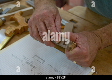 carpenter man working with wood with close up of hands Stock Photo