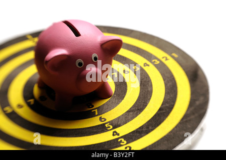 Pink piggy bank on a dartboard Stock Photo