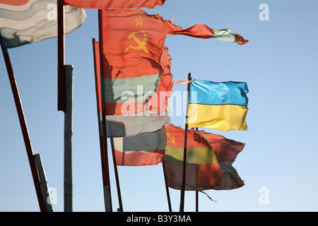 Old Soviet republics flags beside a modern Ukrainian flag waving over ...