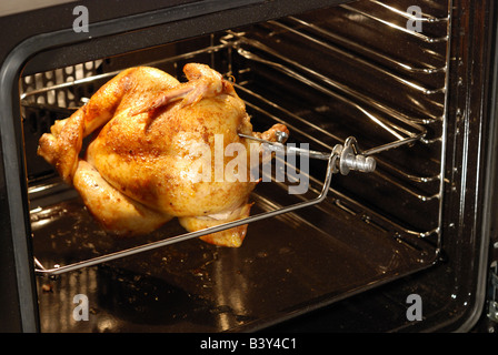 Roasted chicken in oven Stock Photo