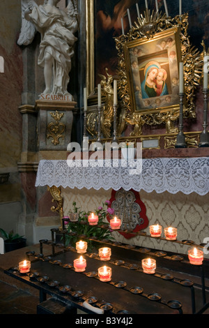 Candle lit shrine inside Peter's Church ( Peterskirche ) Vienna Austria Stock Photo